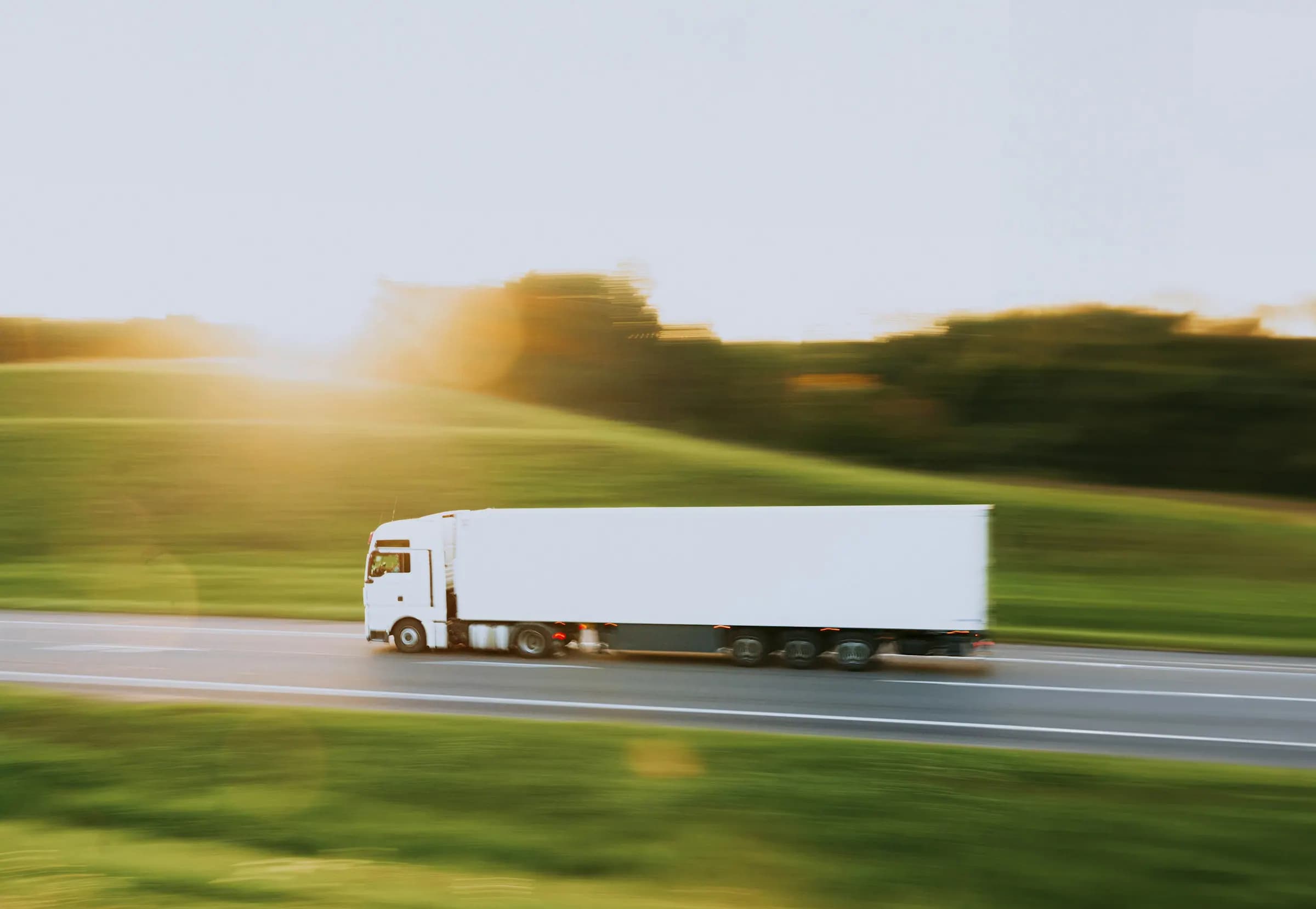A delivery truck on an open highway