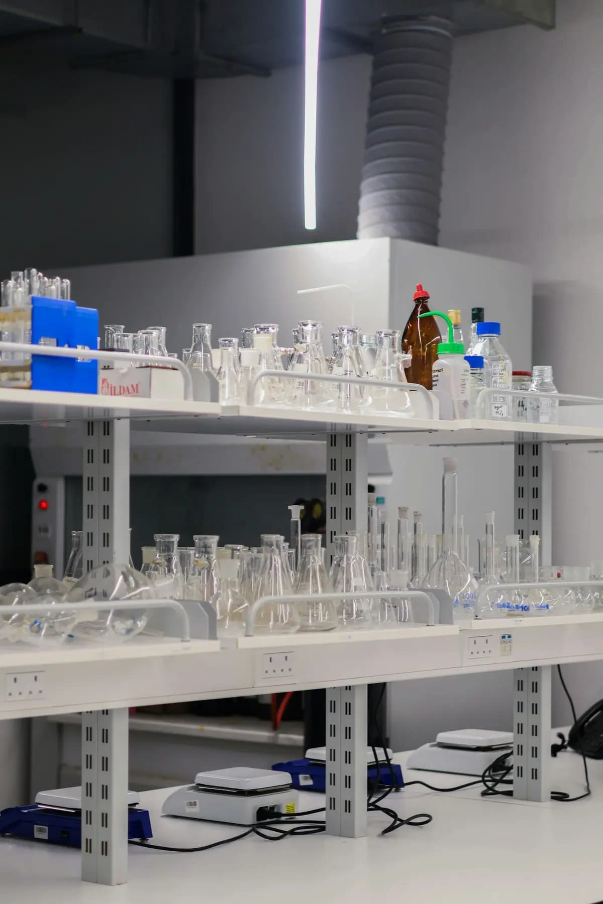 Laboratory shelves lined with glassware