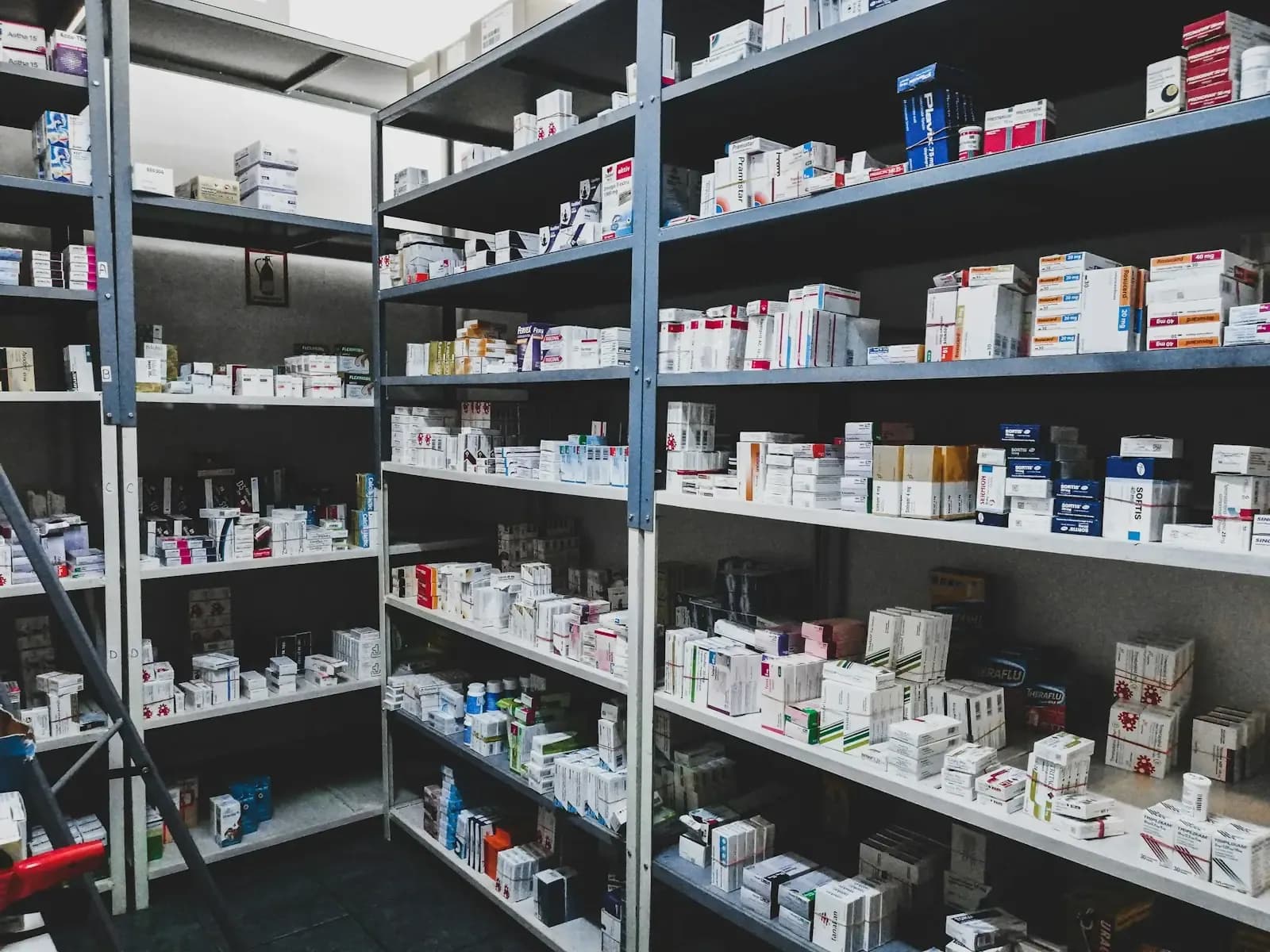 Shelves of boxed stock in a pharmaceutical warehouse